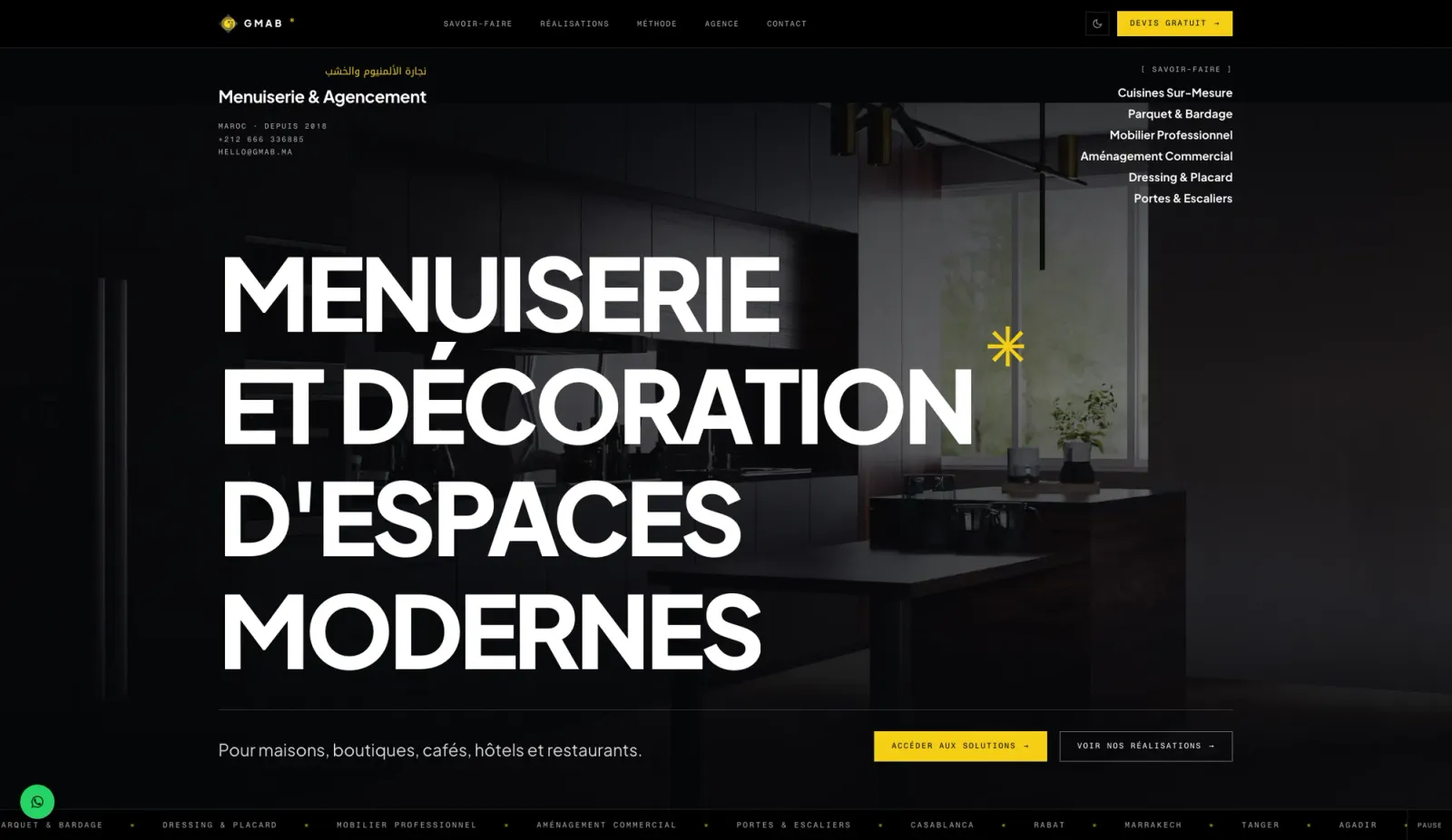 GMAB homepage with the stacked headline Menuiserie et décoration d'espaces modernes and a single yellow accent — dark mode
