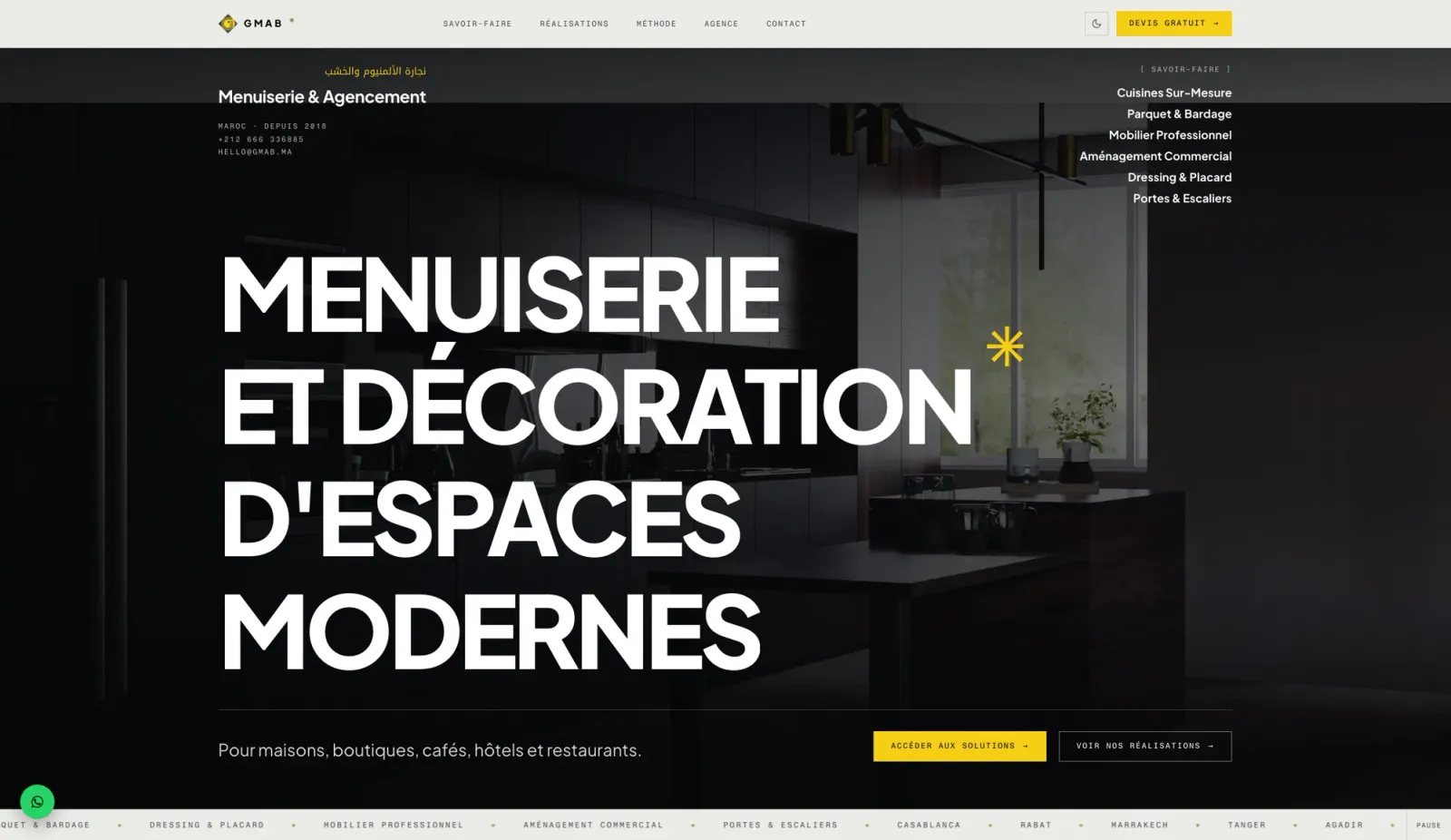 GMAB homepage with the stacked headline Menuiserie et décoration d'espaces modernes and a single yellow accent — light mode